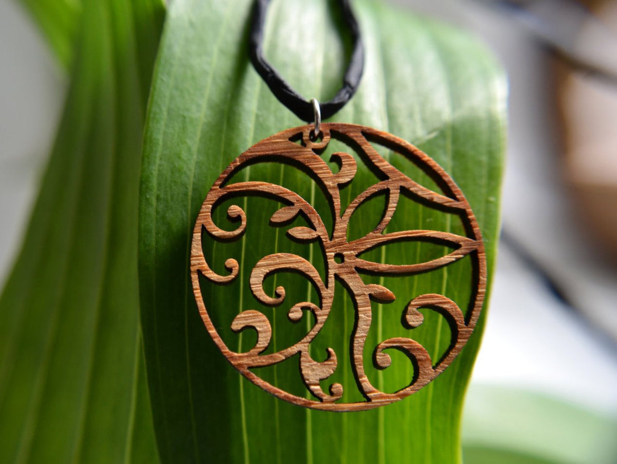 Floral Circle Pendant in cherry on leather cord